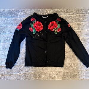 cardigan sweater with appliqué details. See matching shorts in our closet!